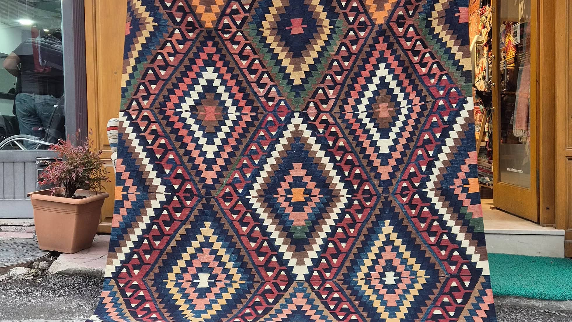 Mid-century Manisa kilim rug with stepped diamond motifs photographed for designers and collectors