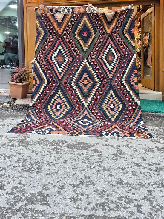 Mid-century Manisa kilim rug with stepped diamond motifs photographed for designers and collectors