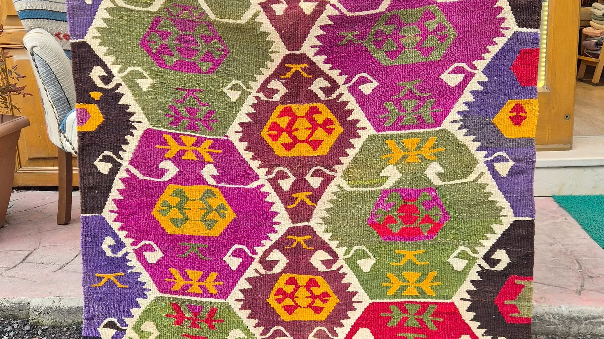 Vintage Turkish Barak Kilim with polychromatic hexagonal medallions and protective tribal motifs from the 1960s