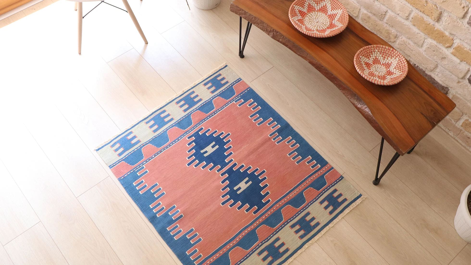 21st-century vintage Turkish kilim rug, 3x4 ft, handwoven with intricate 'comb' motifs symbolizing marriage and birth. Features a refined color palette of dusky salmon, pastel blue, and ivory beige, blending cultural heritage with modern sophistication for small spaces like entryways or reading nooks.