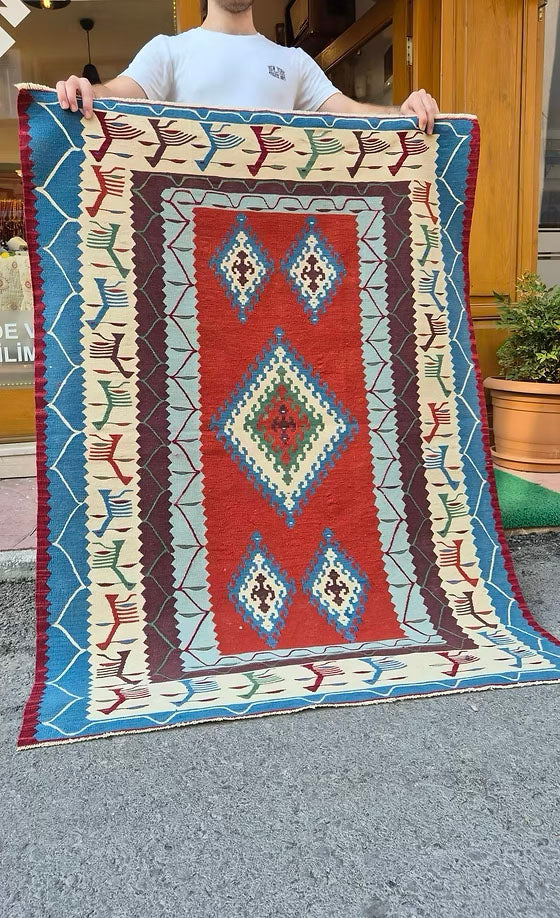 1980s Usak Anatolian accent rug featuring symbolic motifs and geometric patterns