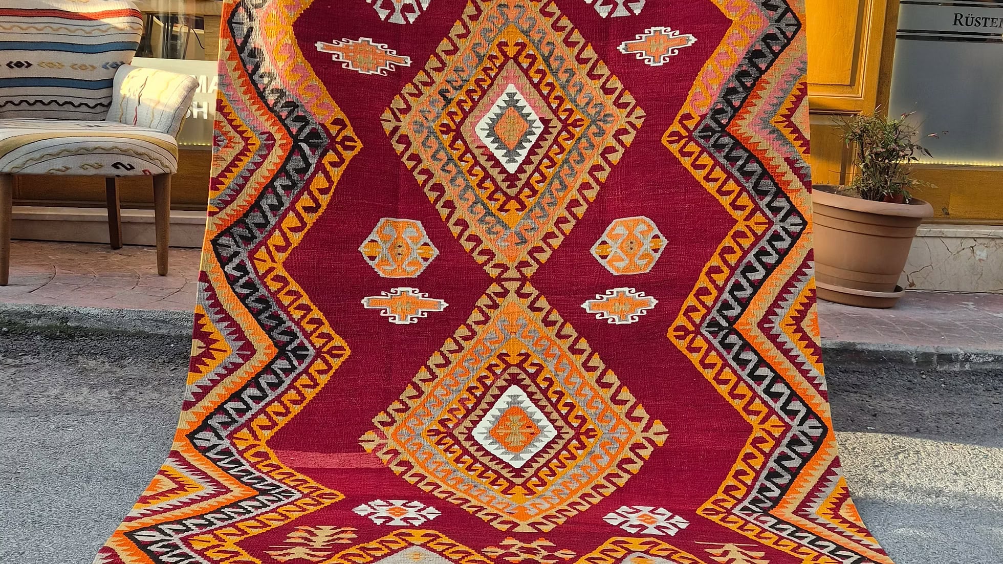 Vintage Turkish handwoven primitive modern diamond flat-woven rug from the 1950s with bold geometric medallions