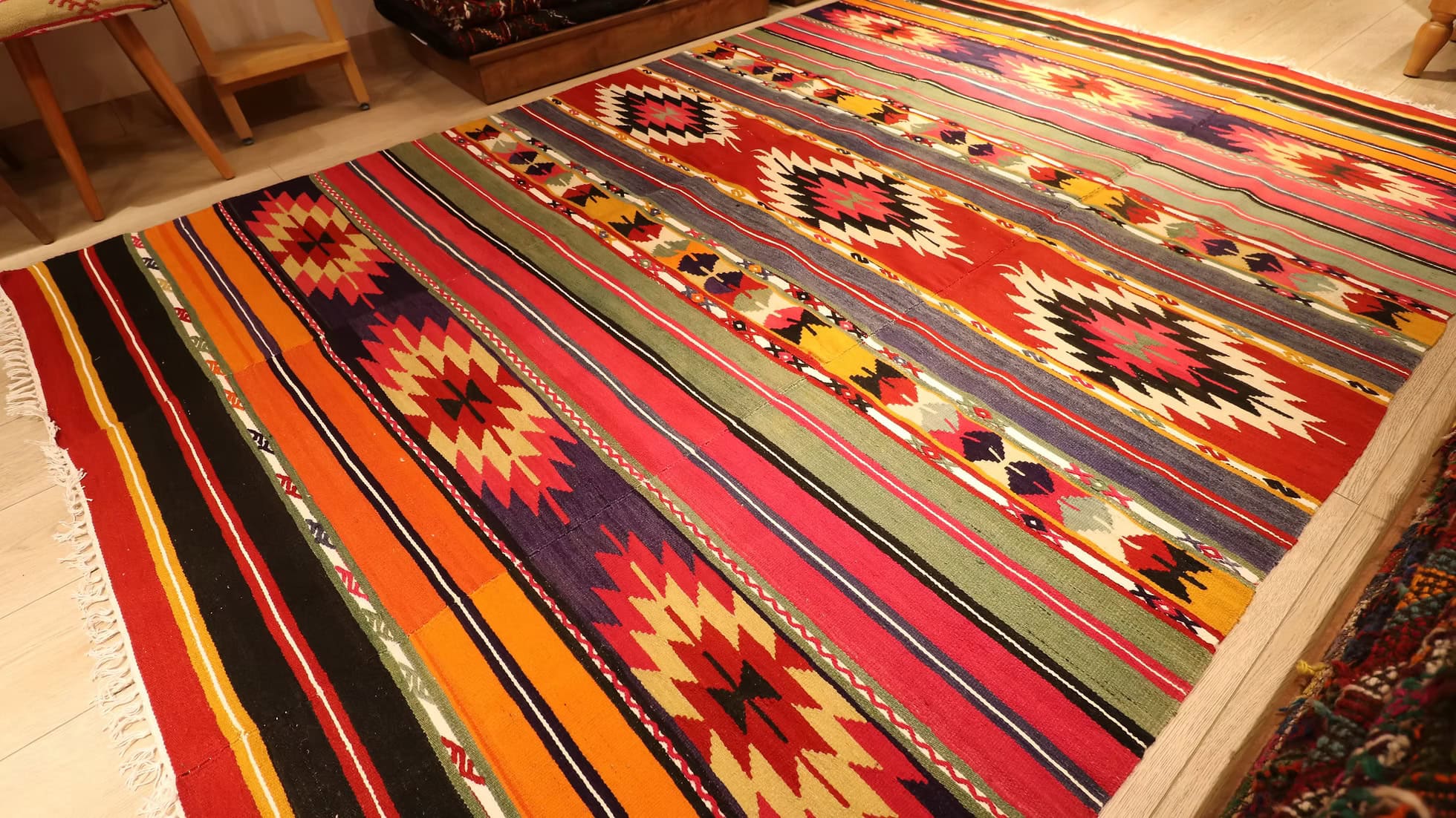 Elegant Vintage Kilim Rug from Kilim Couture New York, displaying traditional Turkish craftsmanship with geometric motifs in vibrant colors