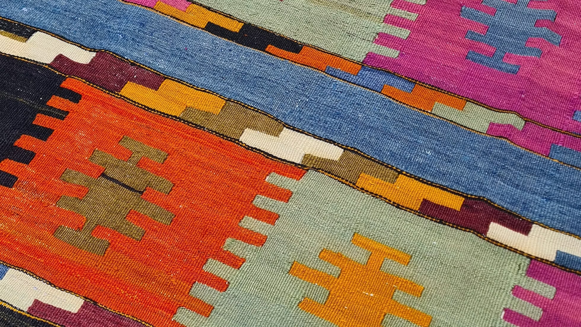 Vintage Turkish handwoven kilim rug. Perfect for upscale NYC interiors, including Soho, Upper East Side, and the Village. Ideal for modern, rustic, or boho-chic spaces in the Hamptons or New York City. Handpicked by Kilim Couture New York for discerning collectors and nyc interior designers.