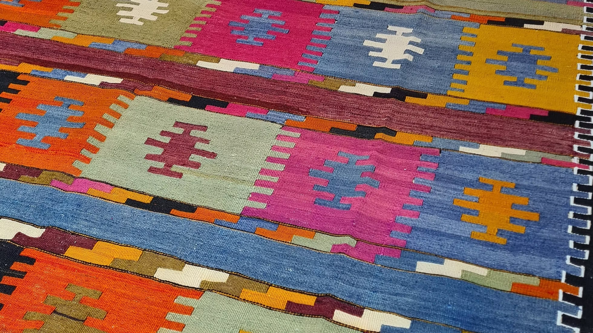 Vintage Turkish handwoven kilim rug with comb motifs in black cherry, blue fig, truffle black, wild hibiscus, and sage, ideal for charming interiors in Southern homes, from Charleston to Savannah to the countryside.