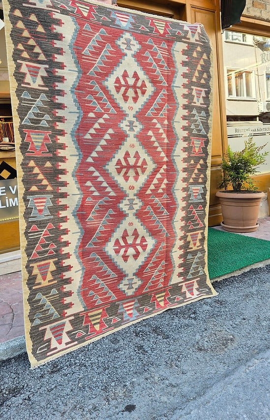 Vintage Turkish Oushak kilim with warm earthy tones and geometric Southwestern patterns, perfect for boho, modern rustic, or curated designer interiors.