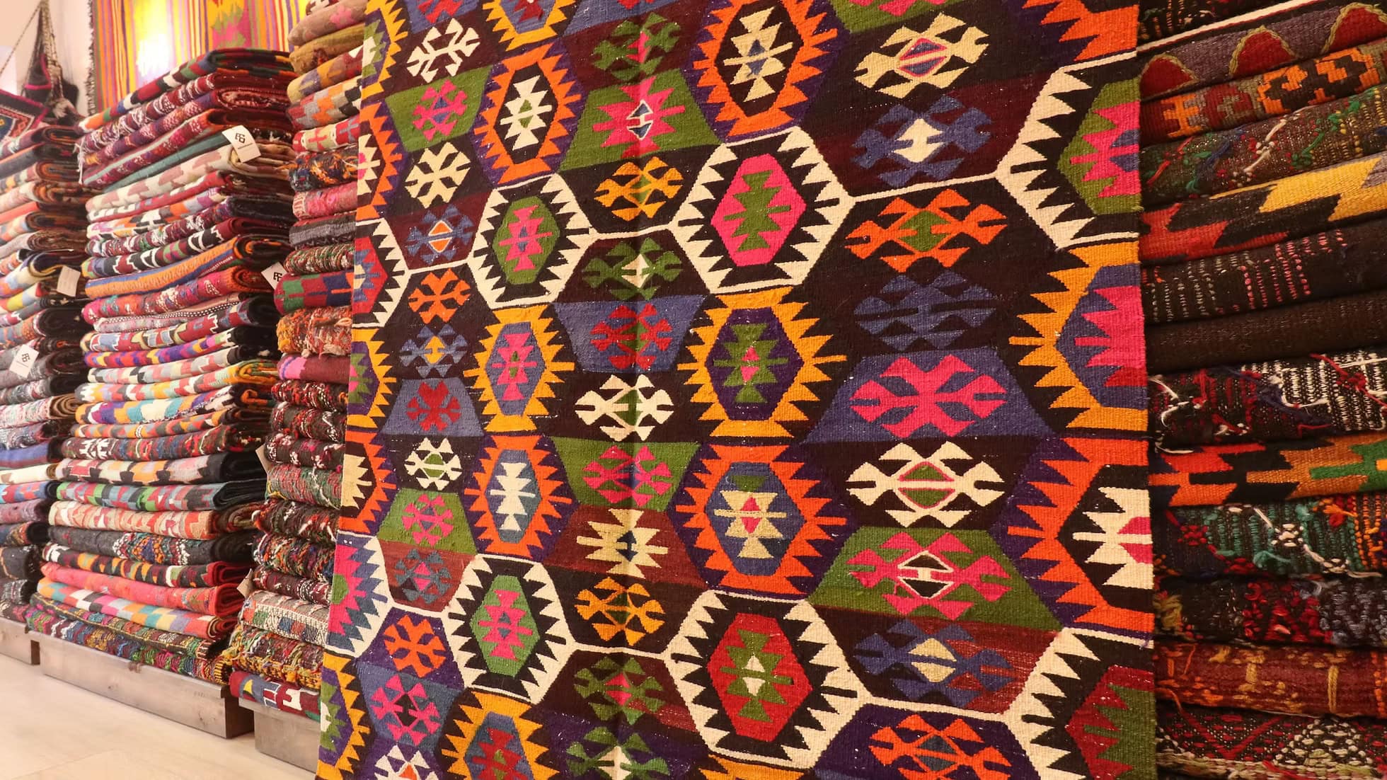 Rare 5x7 ft kilim from Tavas, Denizli, handwoven with vibrant colors and intricate Anatolian motifs. A blend of heritage, craftsmanship, and rustic elegance, featuring soft pistachio green, deep plum, and delicate tassels.