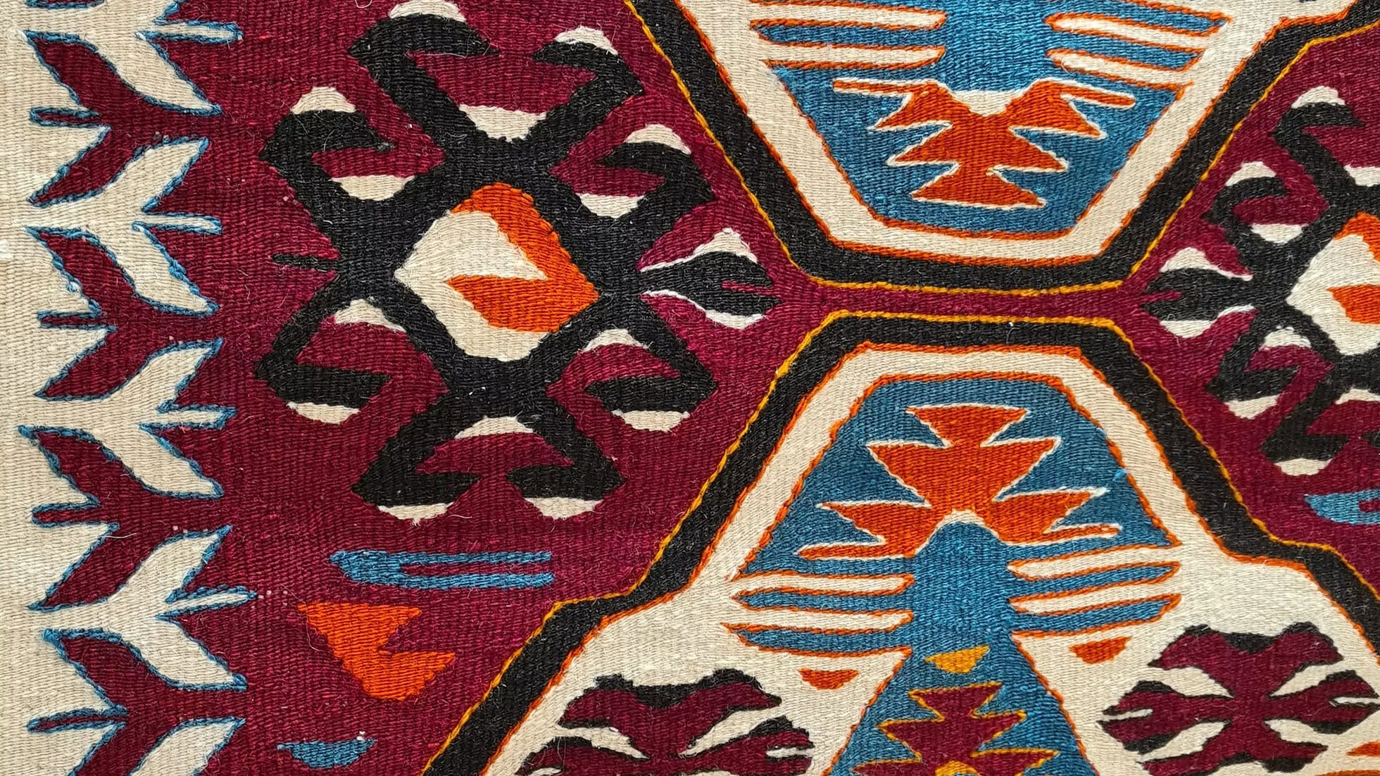 A timeless 3x4 vintage Anatolian kilim with geometric medallions and symbolic motifs, invoking unity and harmony through ancient weaving traditions.