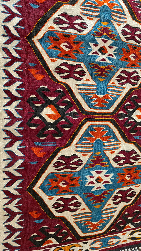 Cultural heirloom Anatolian kilim with earthy hues, handwoven symbols representing fertility, and protection, designed to complement both traditional and modern interiors