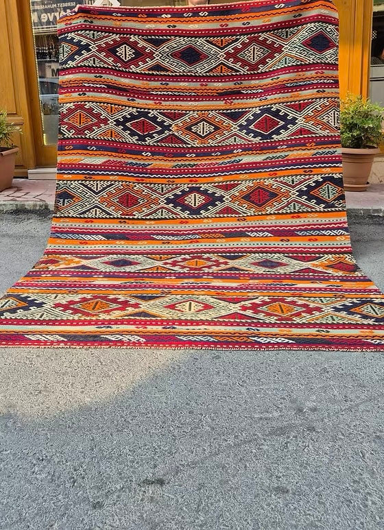 Handwoven vintage Manisa Cecim Kilim rug showcasing richly textured tribal geometric patterns.
