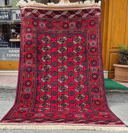 Hand-selected Kilim Couture Bokhara rug featuring bold crimson red and geometric Tekke tribal design, 4 by 6 feet