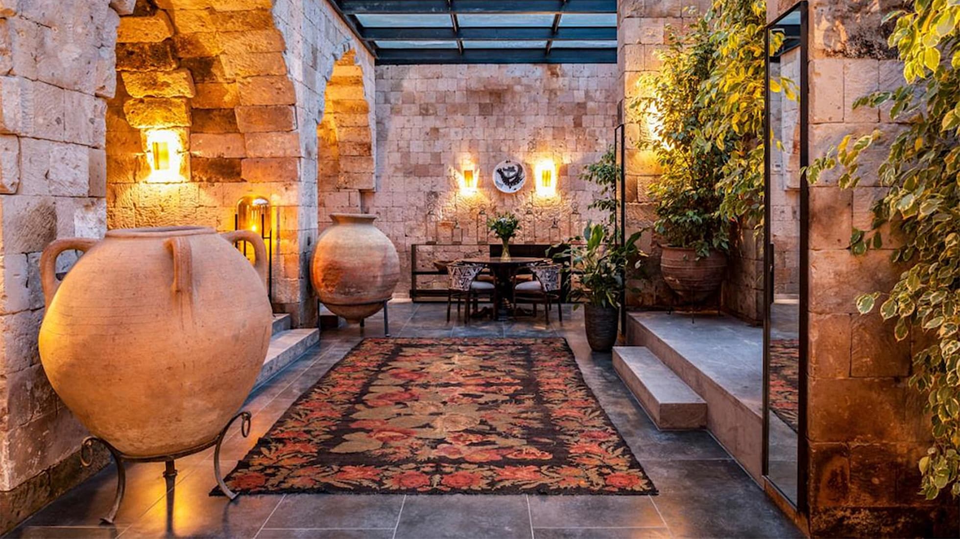 a majestic vintage floral Turkish rug gracefully adorning a beautiful rustic Cappadocia hotel