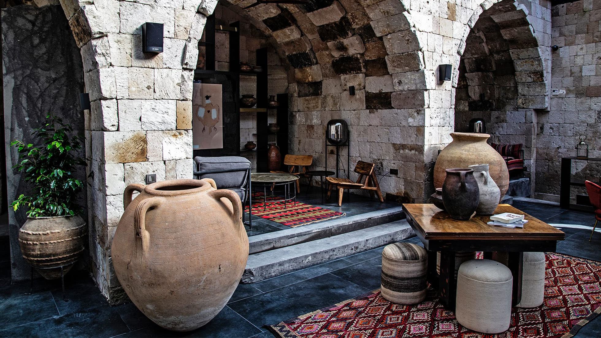 Handwoven kilim rugs adding warmth and character to the rustic interior of a stone cottage, showcasing authentic and timeless design