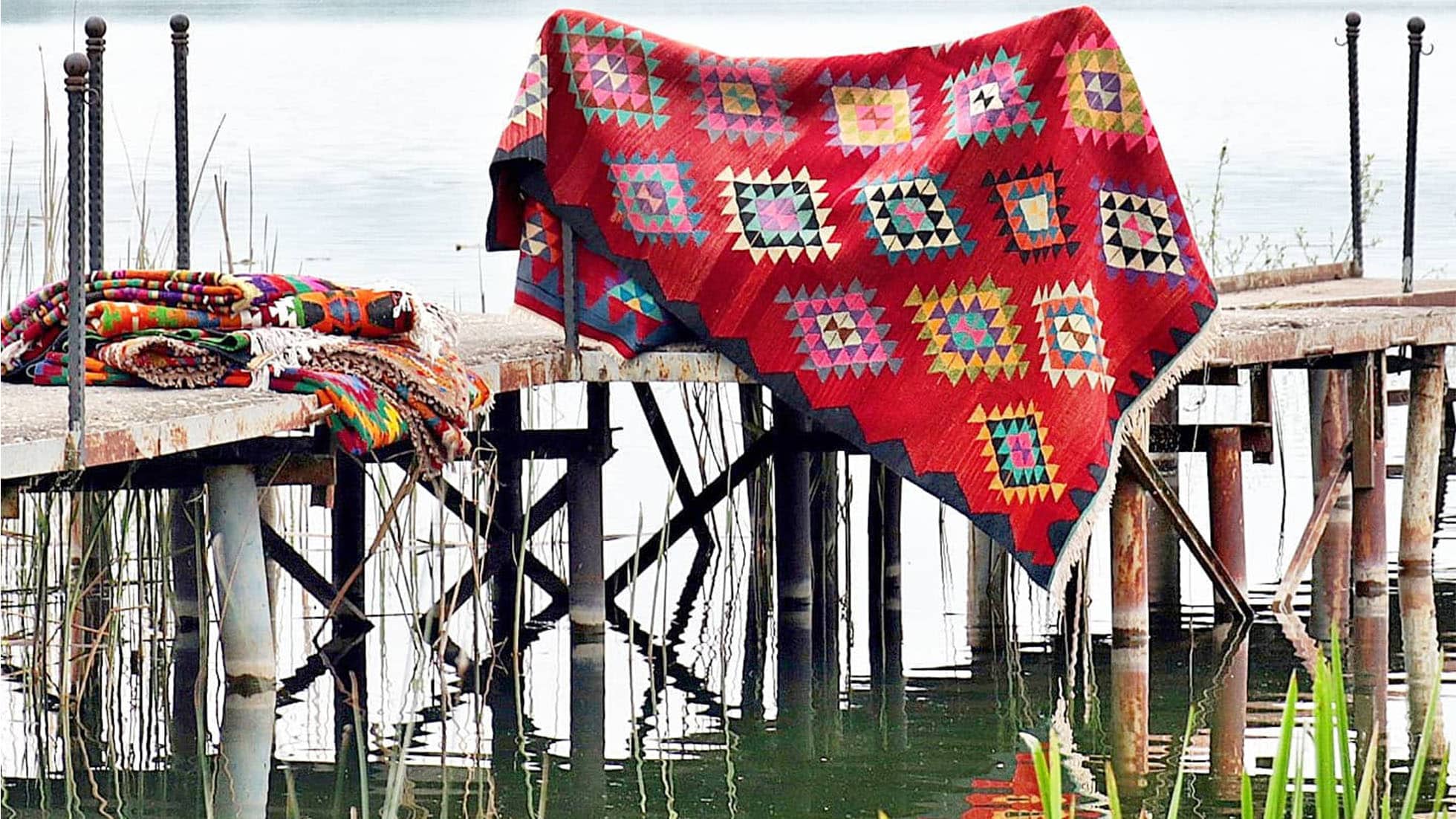 vintage tribal Turkish kilim rug by the lake by Kilim Couture New York