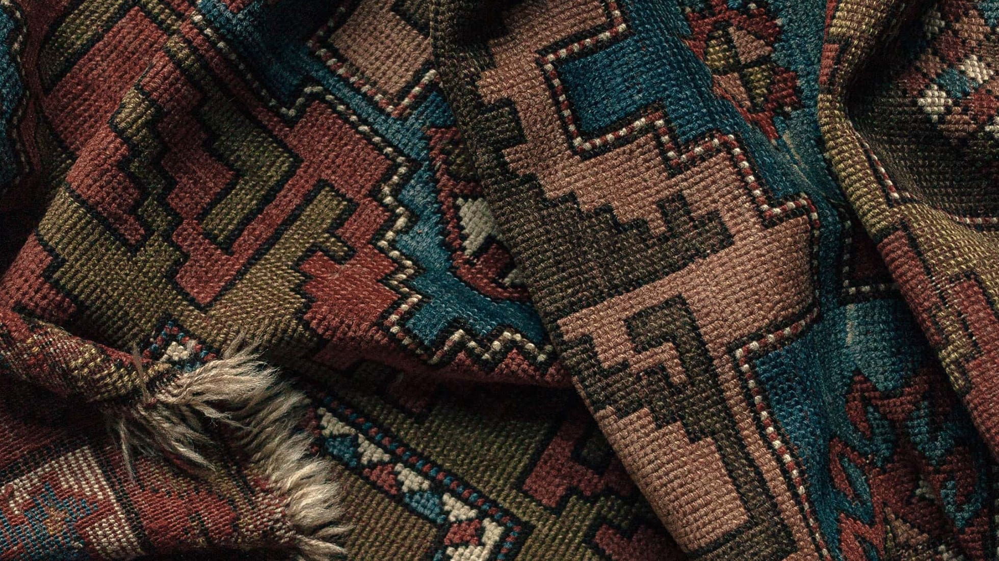Zoomed in detailed tribal vintage Turkish rug in earthy tones