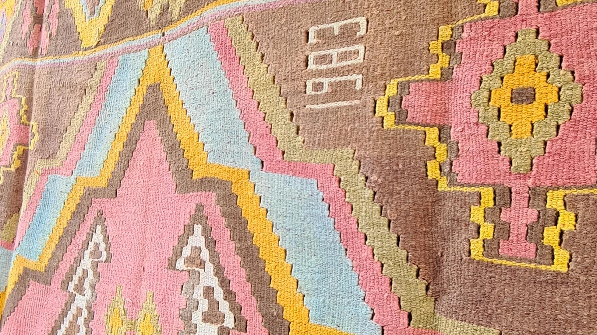 1983 signed caucasian gallery size medallion kilim in pastel hues