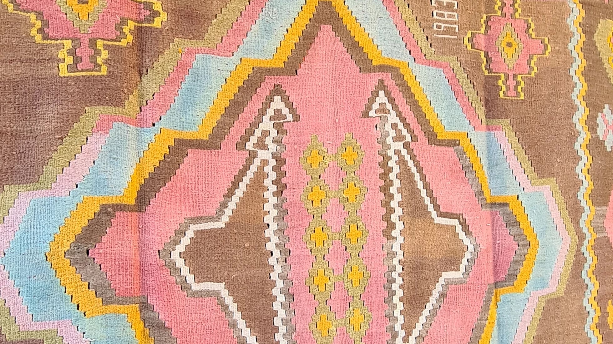 1983 signed caucasian gallery size medallion kilim in pastel hues