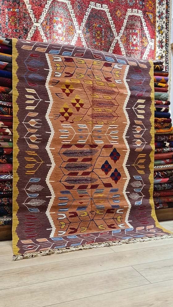 Contemporary Turkish Oushak Kilim with stylized tulip motifs in antique brown