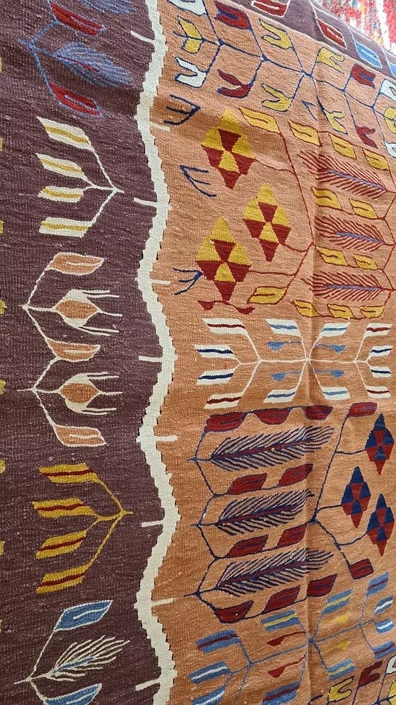 Turkish Oushak flat-weave kilim featuring floral motifs in mocha mousse.