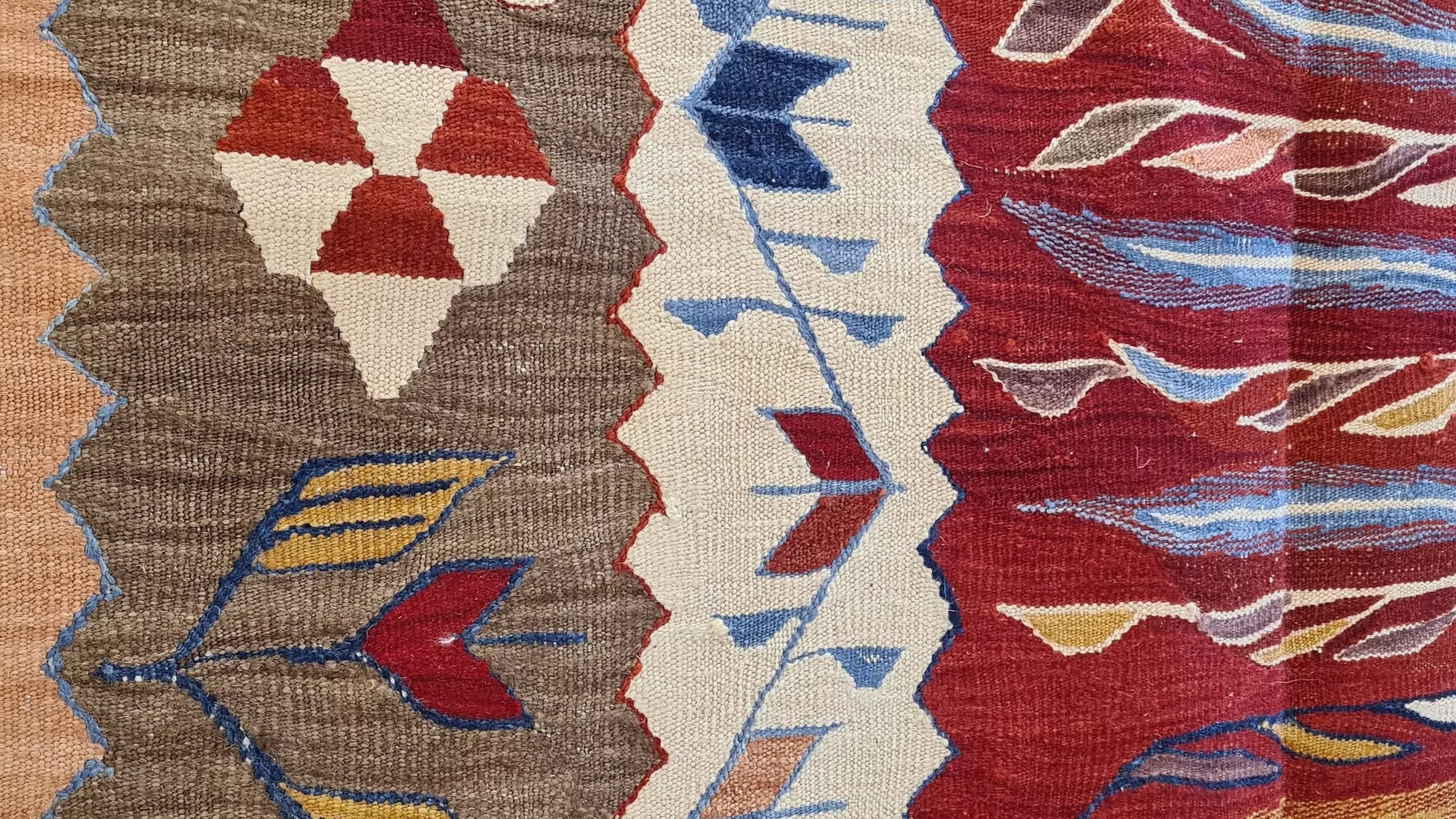 Vintage-style contemporary Oushak kilim with tulip motifs — red, taupe, salmon, and blue Turkish flat-weave for designers