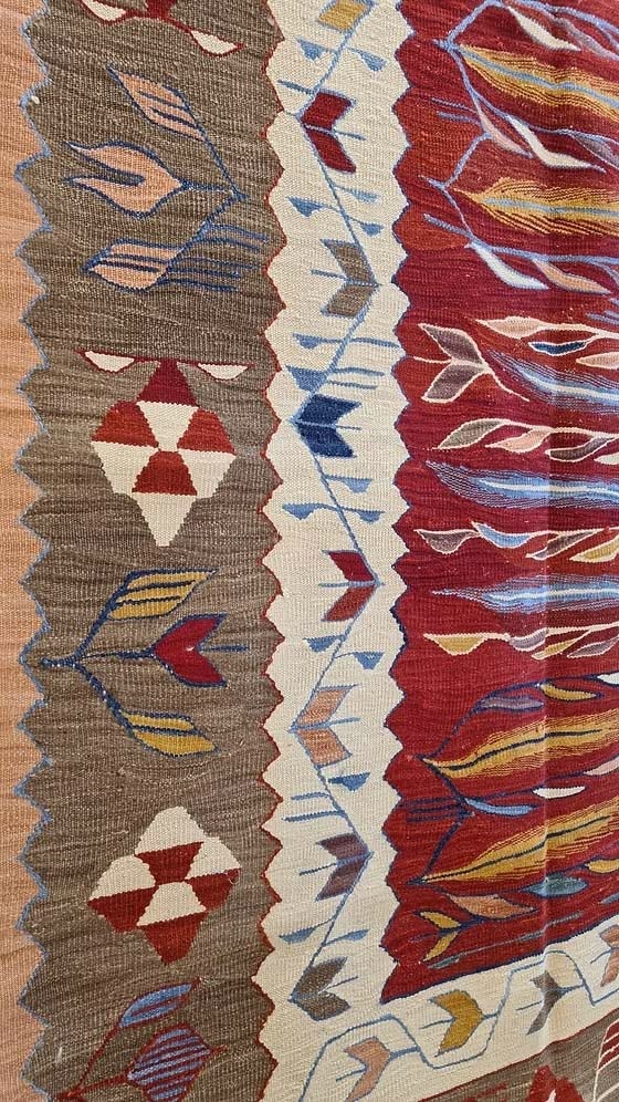 Vintage-style contemporary Oushak kilim with tulip motifs — red, taupe, salmon, and blue Turkish flat-weave for designers