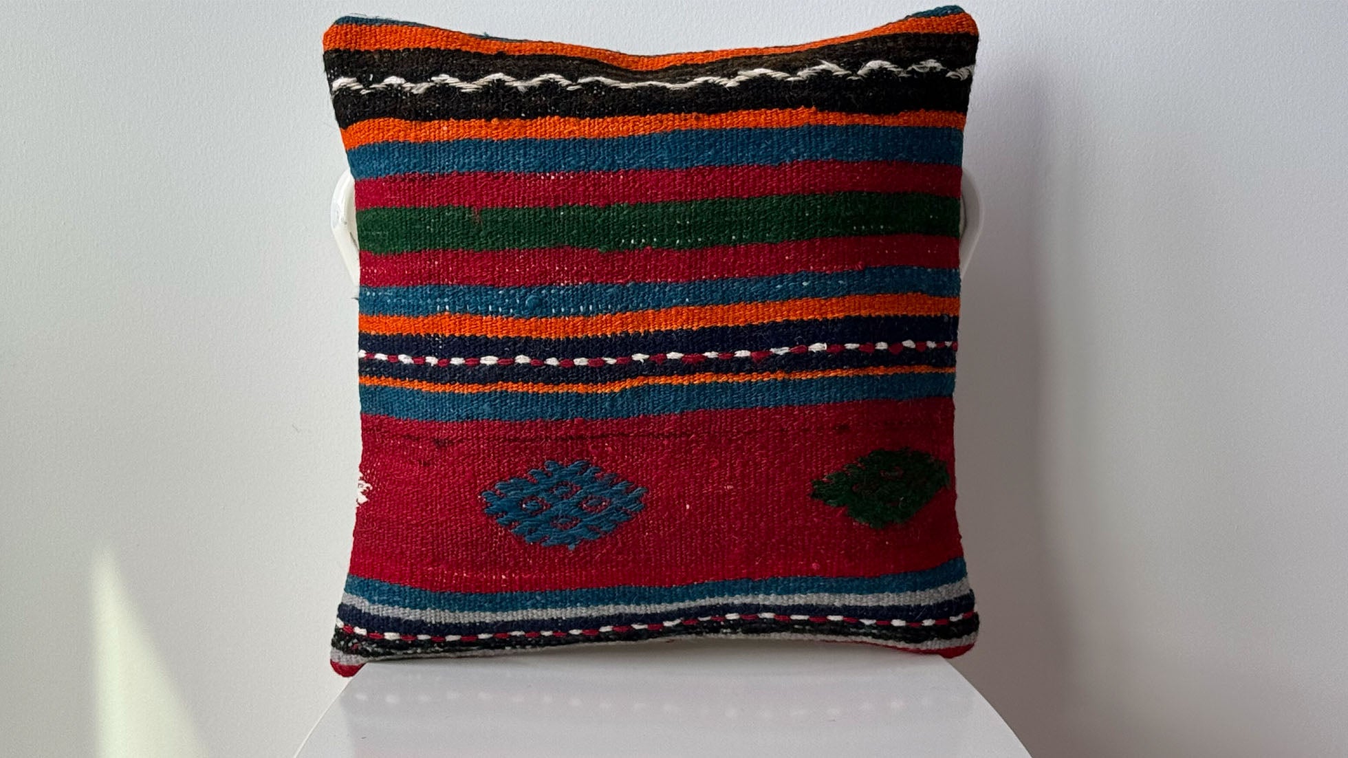 Vintage Handwoven Kilim Decorative Throw Pillow with Geometric Stripes, Black Accents, and Intricate Traditional Turkish Patterns, crafted from mid-century kilim fragments.