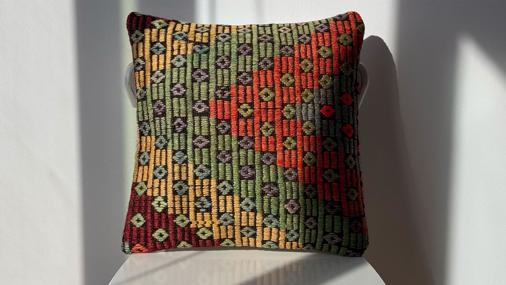 Handcrafted vintage rustic kilim pillow featuring earthy tones of rustic green, orange, gray, and yellow. Woven using the traditional Cecim technique, known for its embroidered look, this pillow blends Turkish cultural heritage with modern design.