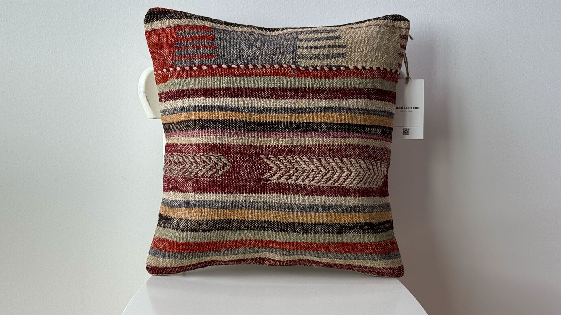 Handwoven vintage Turkish kilim pillow in pastel brick, khaki, and soft gray with tribal motifs, 16x16, ideal for high-end interiors, sustainable design, and luxury home accents.