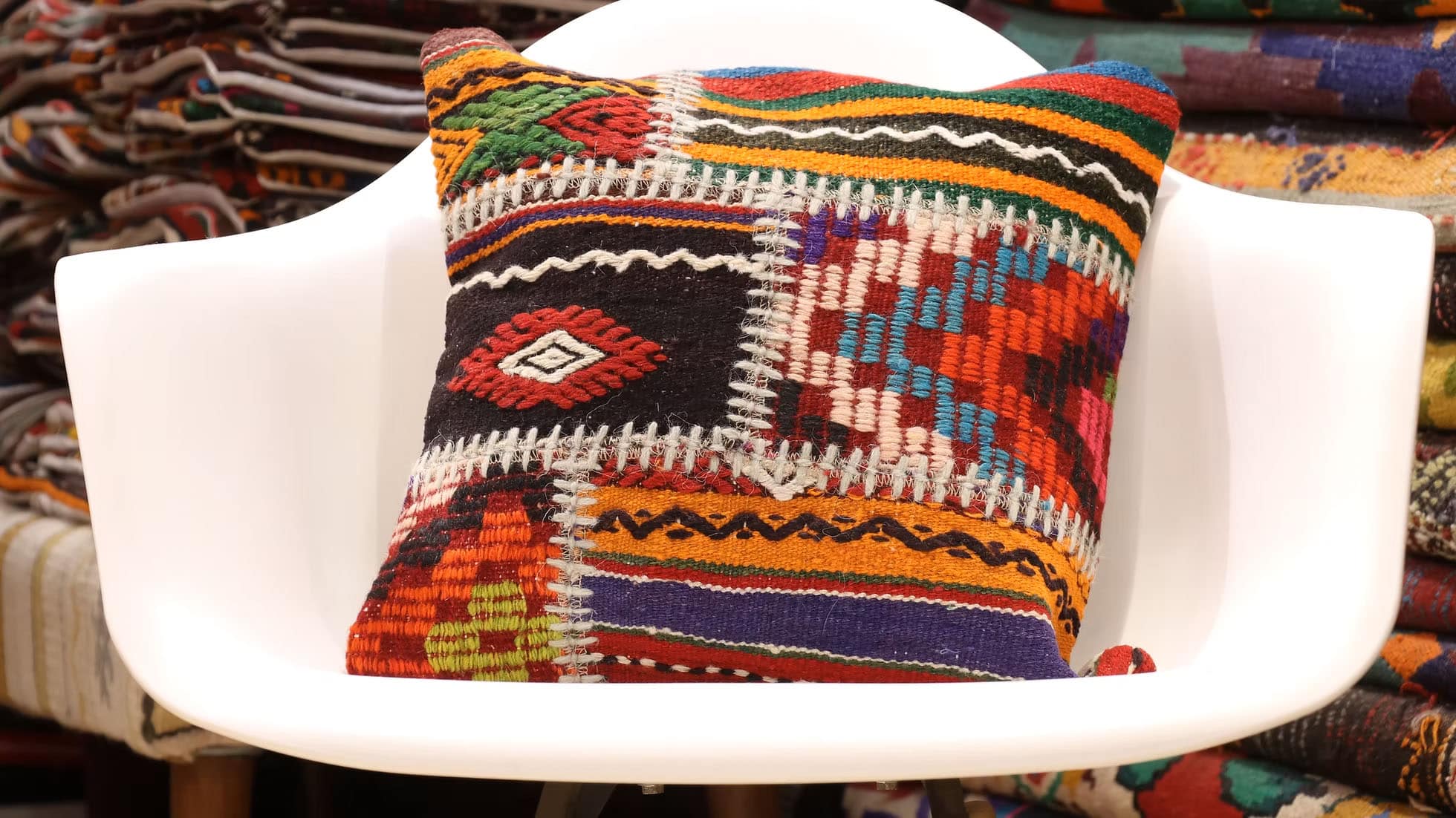 Vintage Patchwork Kilim Pillow. Handwoven from carefully selected vintage kilim fragments, this one-of-a-kind pillow showcases intricate tribal patterns rich in symbolism and history. A testament to Anatolian craftsmanship, it brings depth, authenticity, and timeless artistry to any space while supporting sustainable, ethical weaving traditions.