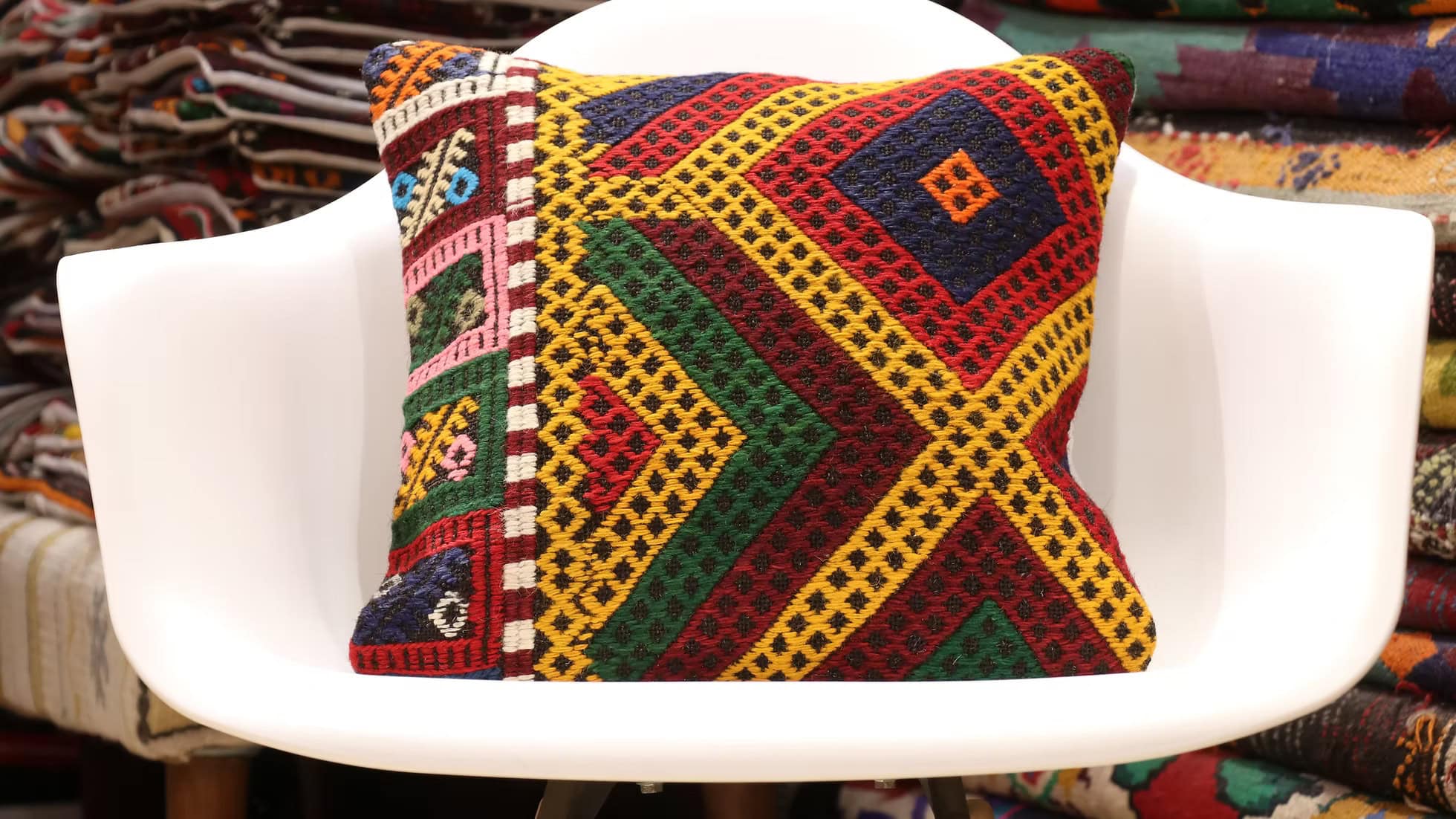 Artisan-made vintage kilim pillow by Kilim Couture New York, handwoven from eco-friendly wool and cotton in rich colors like Saffron Gold, Amber Flame, and Verdant Moss. Intricate cicim patterns showcase timeless design, perfect for interior designers and mid-century home decor enthusiasts