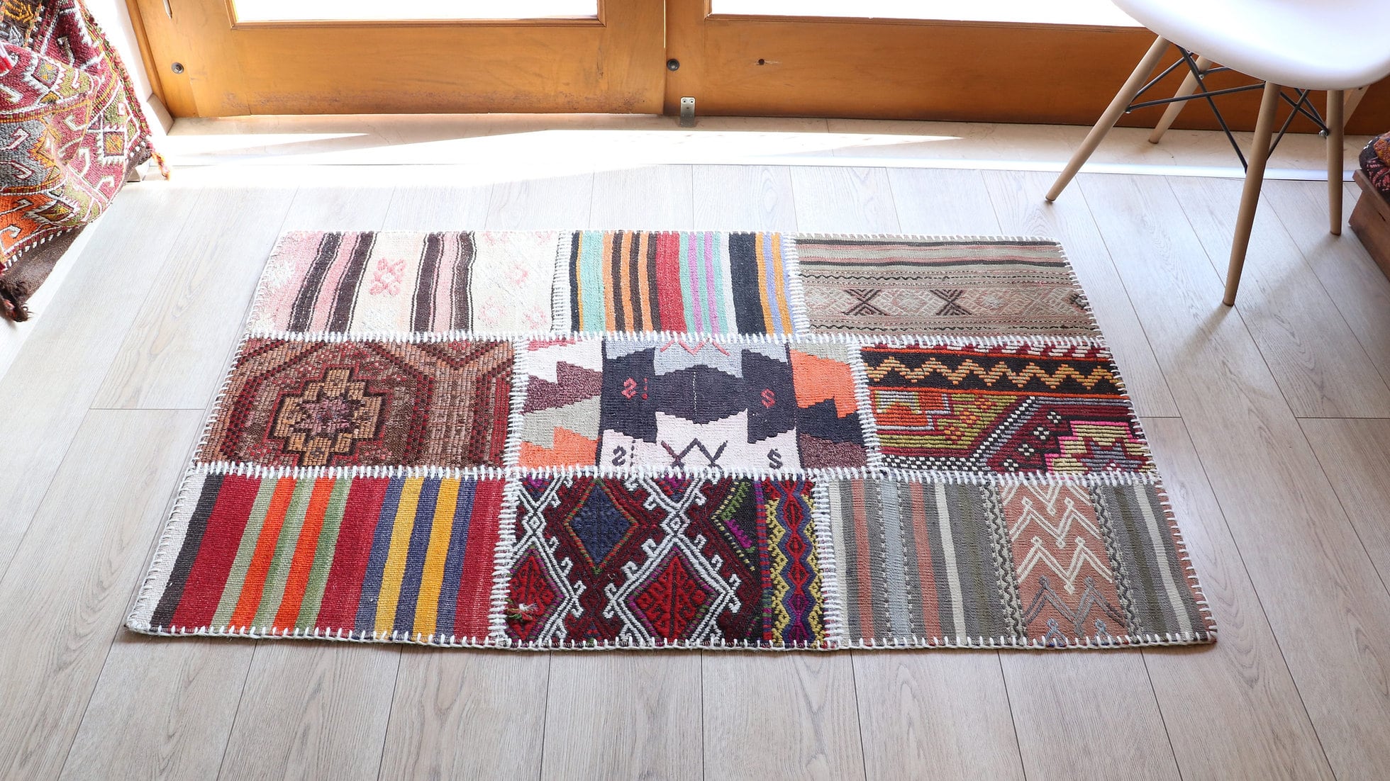 Patchwork antique carpet in vibrant colors and patterns