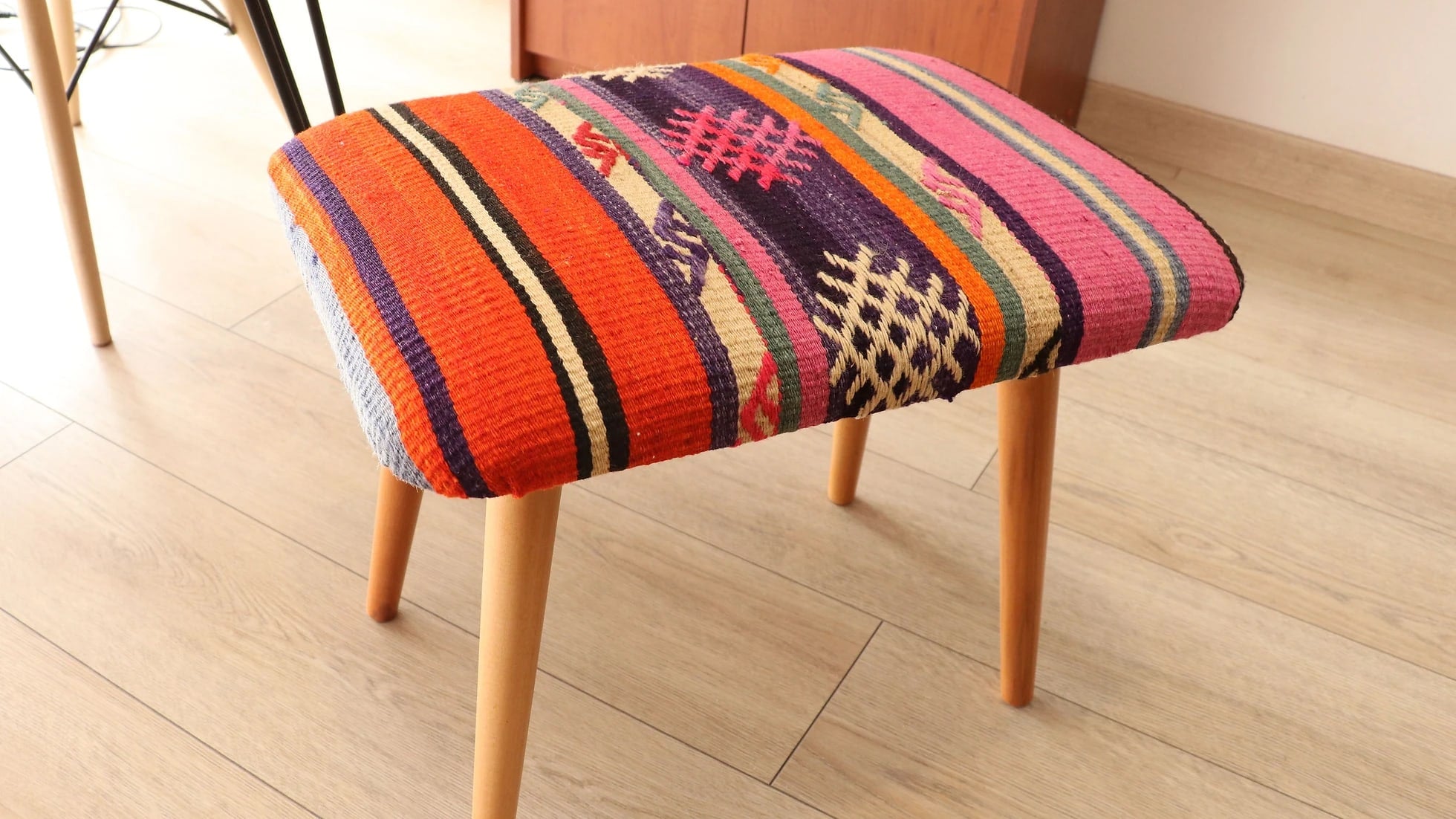 vintage flat-woven kilim upholstered footstool with wooden legs