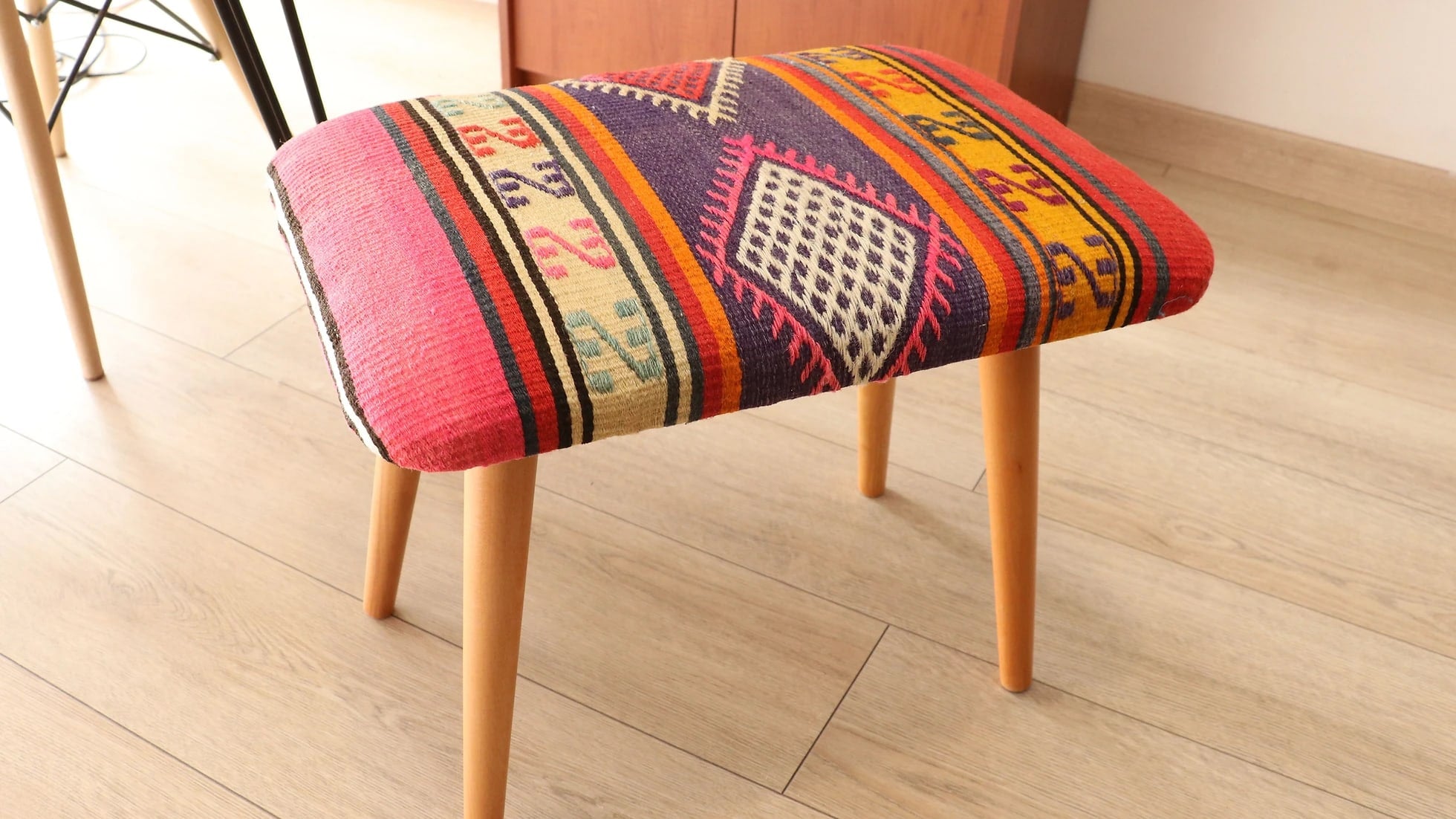 colorful and magnificent ottoman stool bench sustainably handcrafted by local Turkish artisans featuring traditional kilim motifs