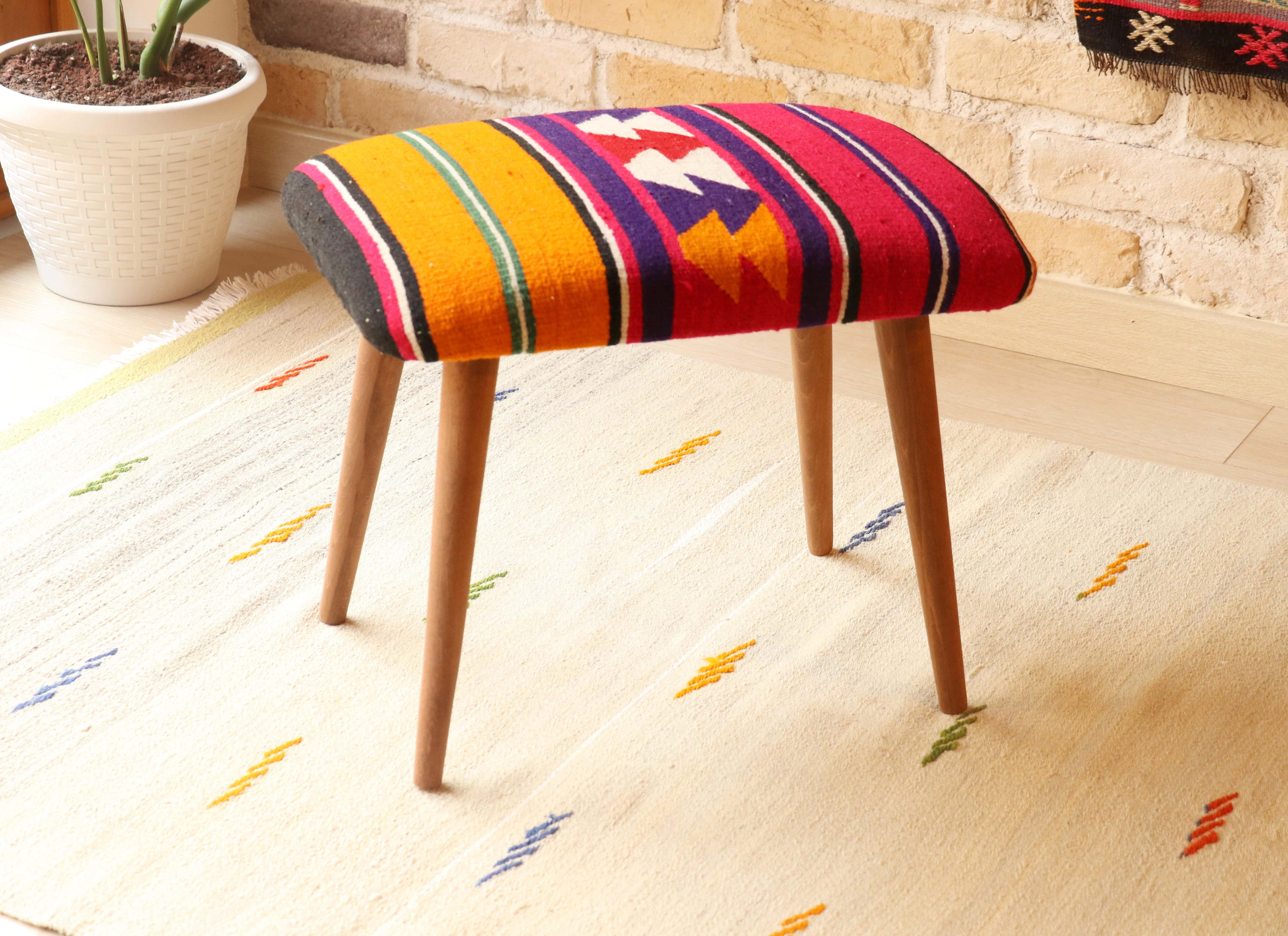 Vintage Kilim Upholstered Stool with Polychromatic Stripes in Tangelo, Fuchsia Fedora, and Amethyst Purple, handcrafted from Turkish kilims, mid-century modern design with removable wooden legs.