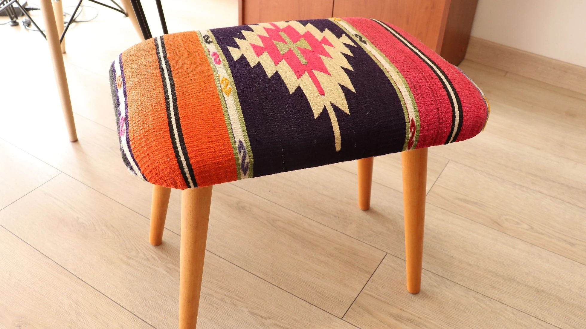 upcycled kilim furniture with tribal motifs and vivid colors