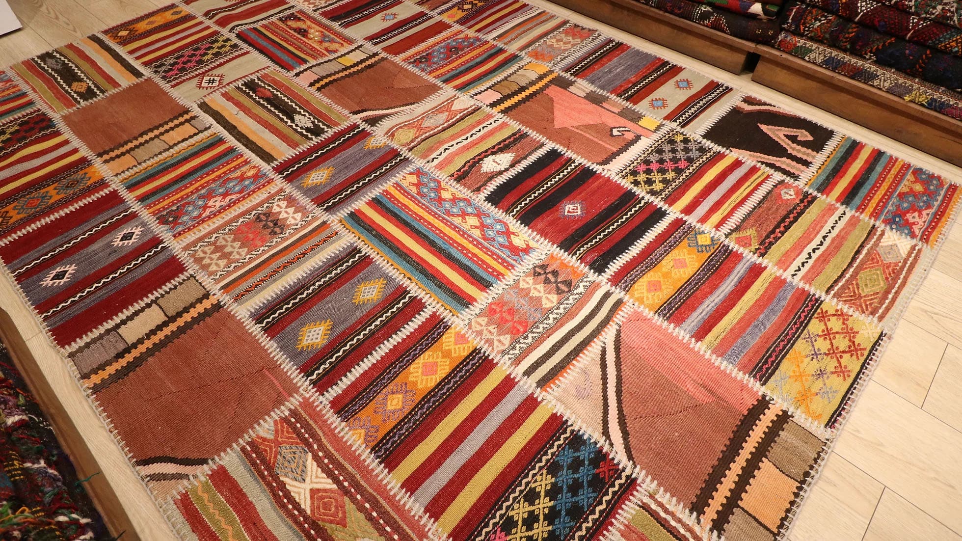 meticulously handwoven semi-antique patchwork rug made of different antique Turkish carpet fragments