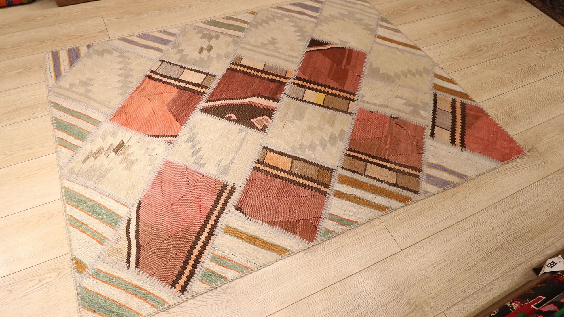 neutral patchwork flat-weave rug in rustic earth tones by Kilim Couture in Manhattan