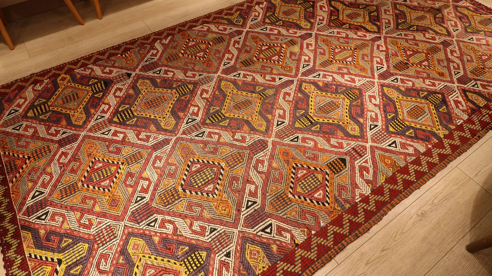 a very captivating Cicim rug from Turkey in natural earthy color palette with many all over traditional geometric patterns and motifs