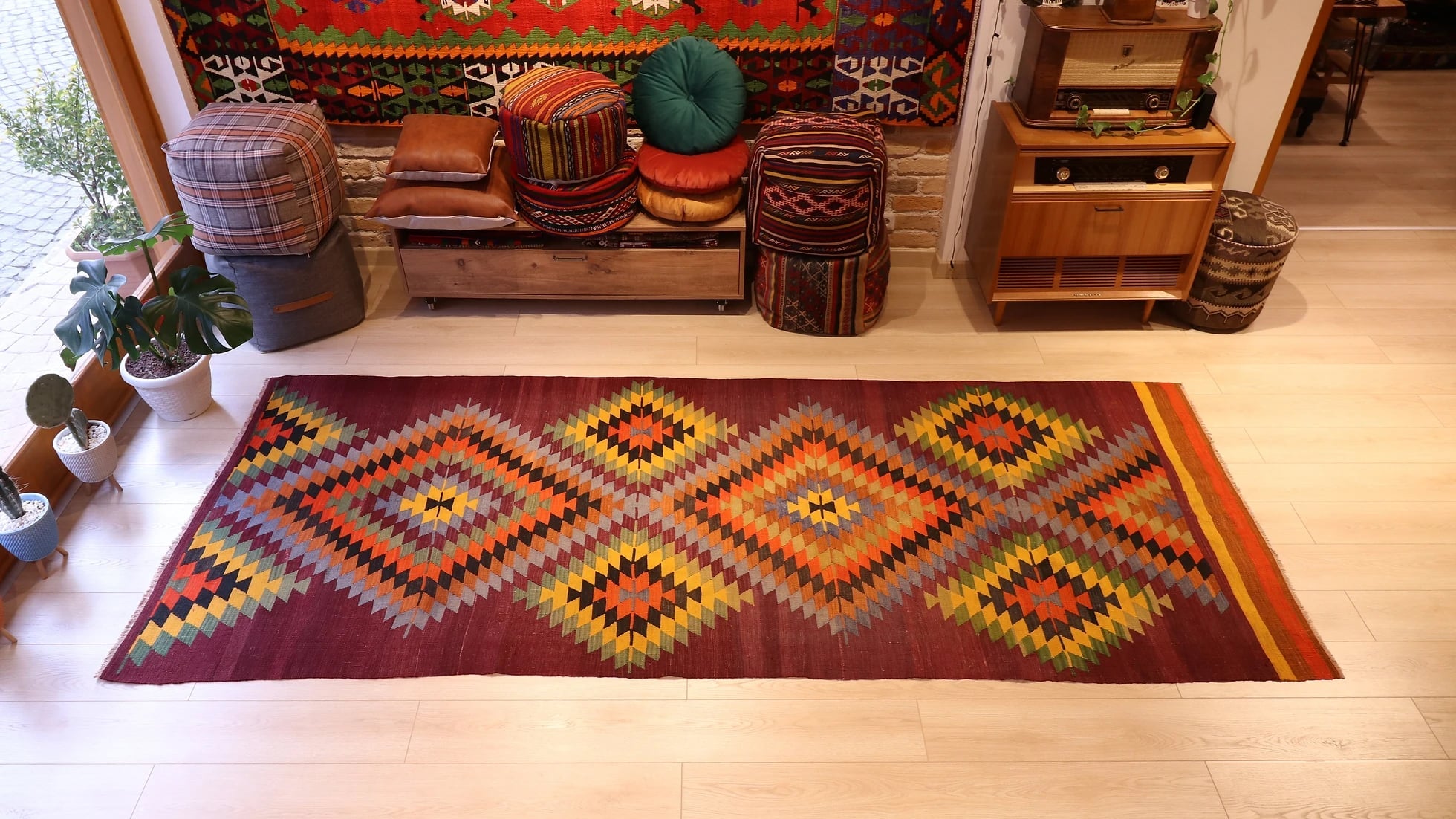 vintage handwoven Turkish geometric runner rug in multicolored lozenge patterns 