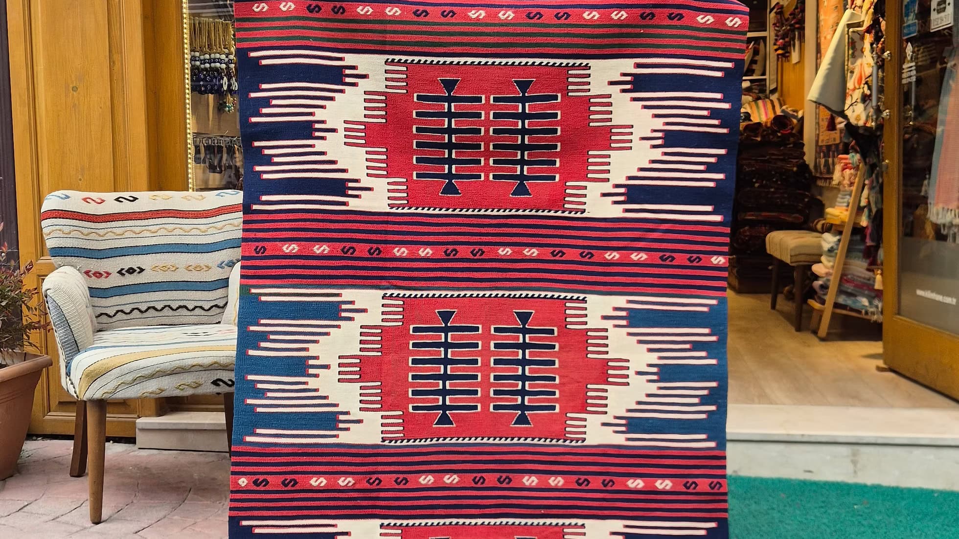 Luxury handwoven flat-weave farmhouse rug with striped tribal design in red and indigo