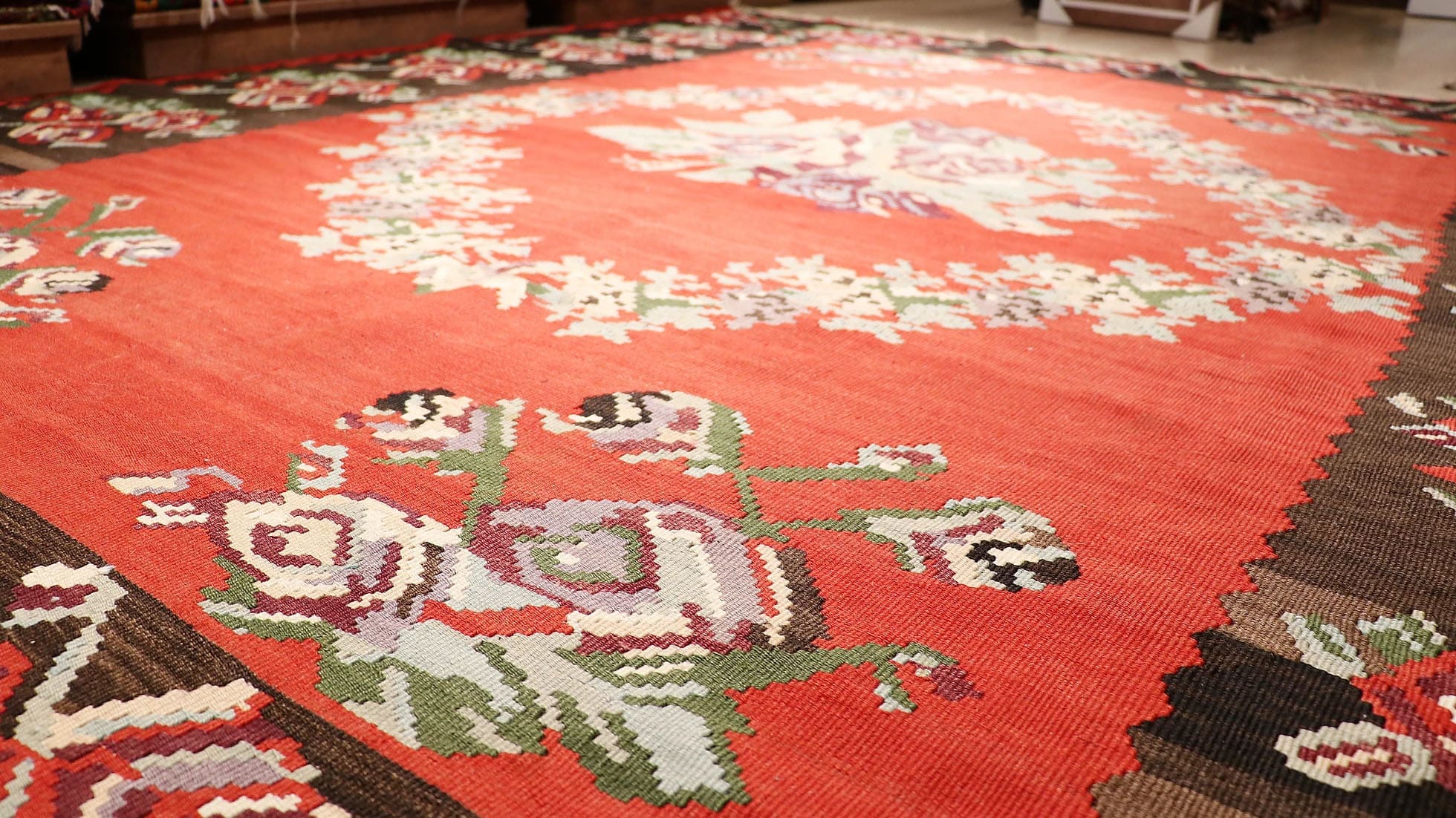 Vintage Moldavian Bessarabian Rug, 8x10 ft. This handwoven treasure showcases a deep crimson backdrop adorned with intricate floral bouquets in lavender, cream, sage, and aqua. Perfect for eclectic or bohemian interiors, its timeless European design adds character and warmth to any space.