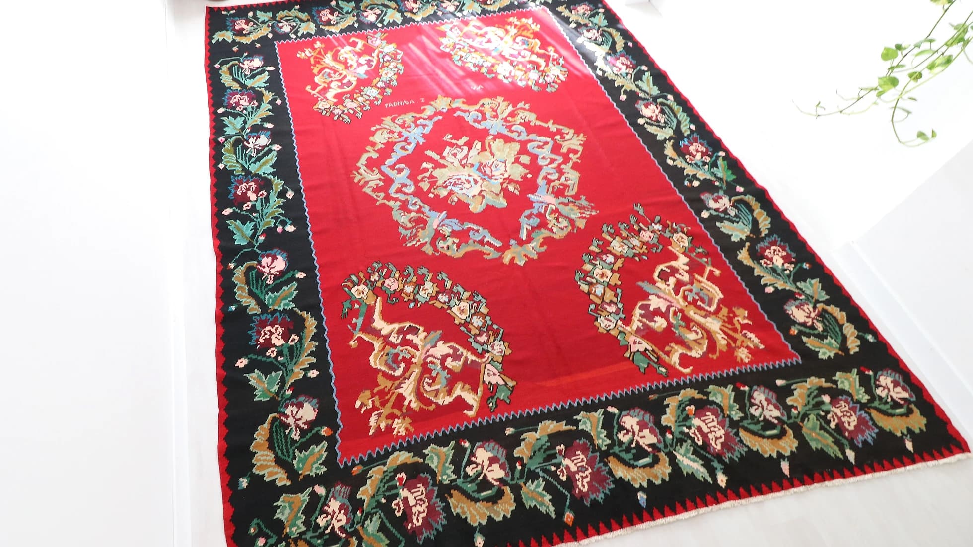 Vintage Hand-knotted Bessarabian Rug in red shades with floral design signed by the artisan