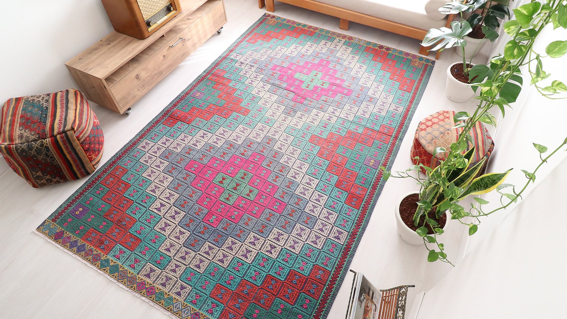 Vintage hand woven Cecim Kilim Rug with faded hues in pink, red and green