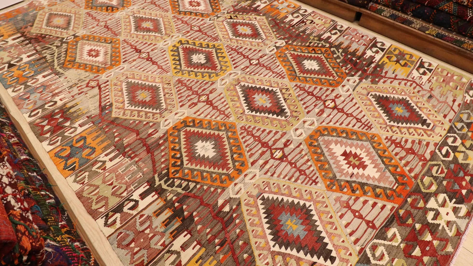 vintage handwoven Turkish rustic kilim rug in muted neutral hues and tribal motifs by Kilim Couture New York rug gallery