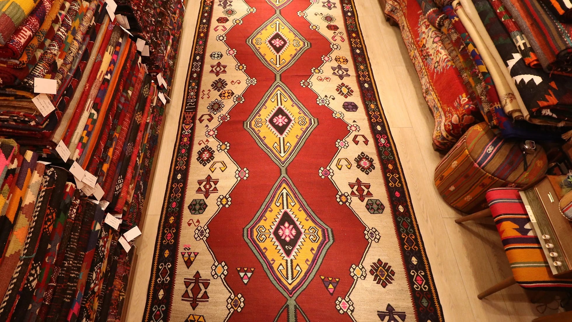 vintage gorgeous kars medallion runner rug showcasing many traditional Anatolian patterns and motifs in earthy and vibrant colors