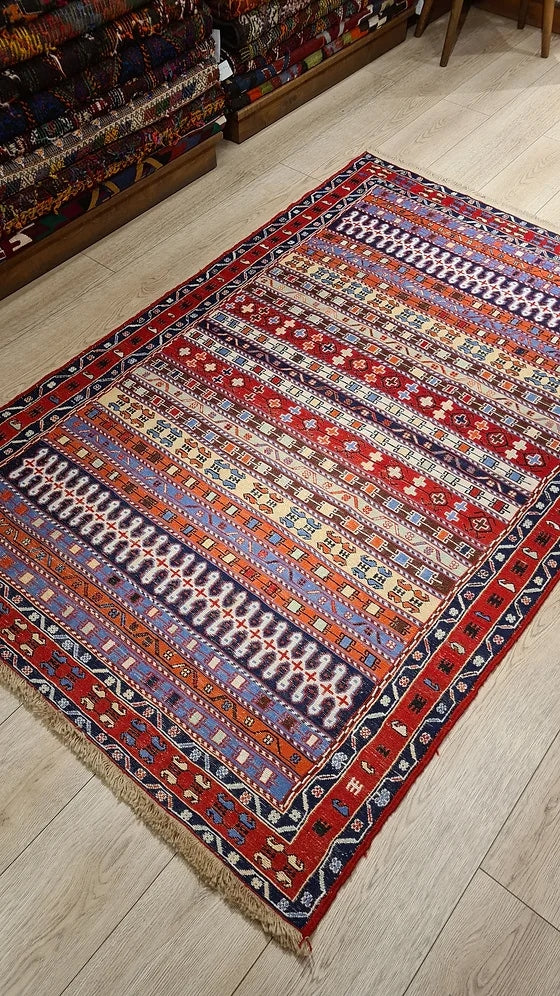 Vintage Persian Sumak Oriental Rug in red featuring a lot of distinctive traditional Persian motifs