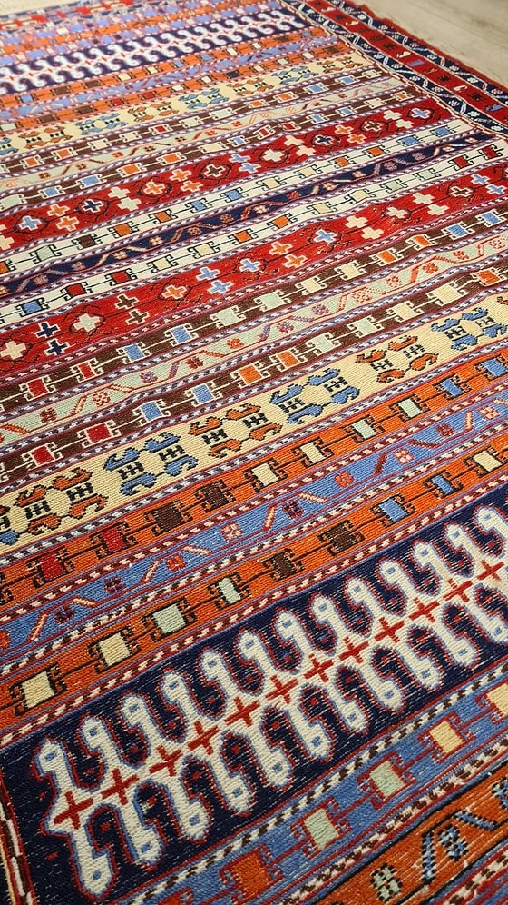 Vintage Persian Sumak Oriental Rug in red featuring a lot of distinctive traditional Persian motifs