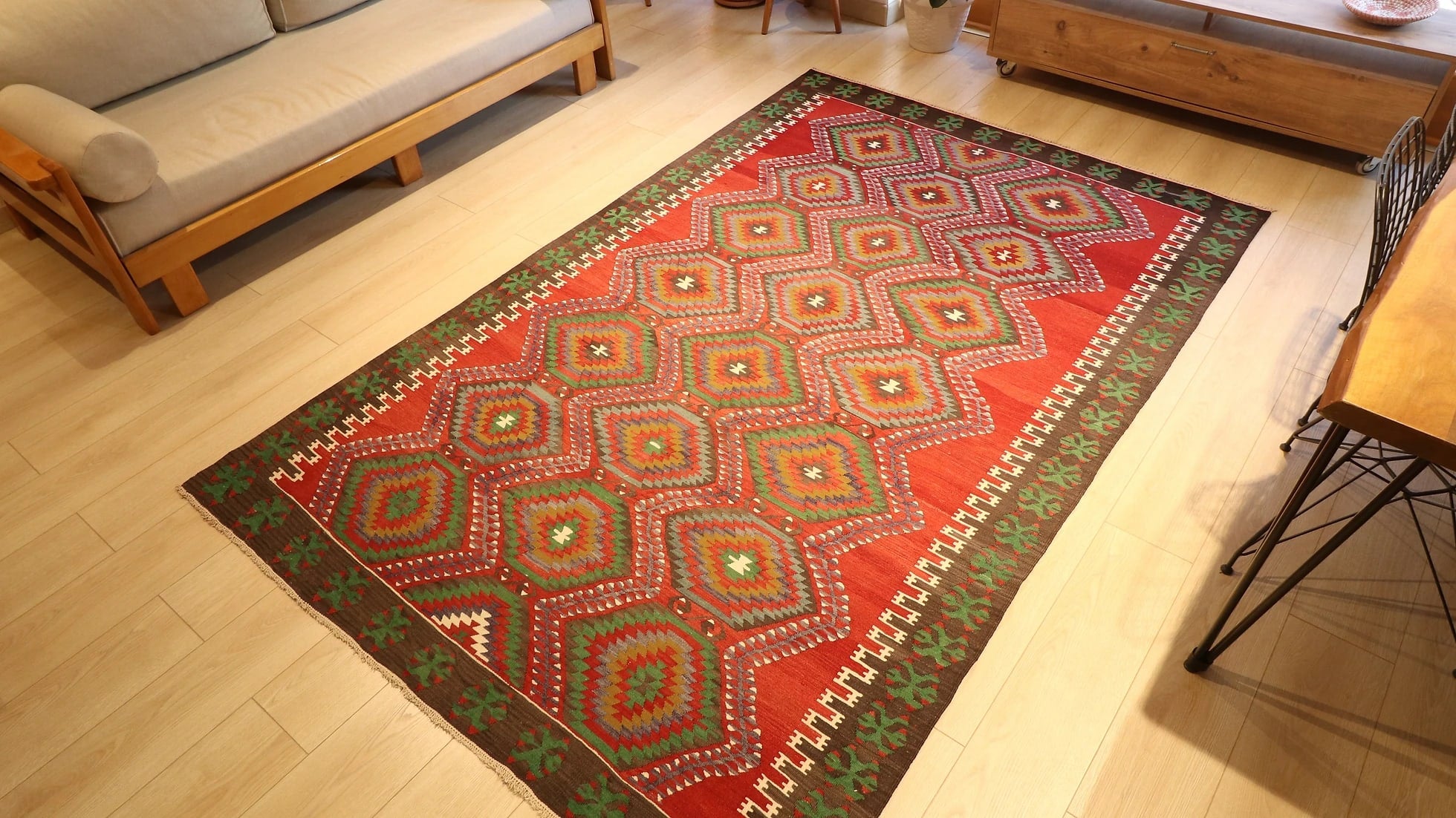 transitional and eclectic premium Oushak Esme rug is displayed in a beautiful living room
