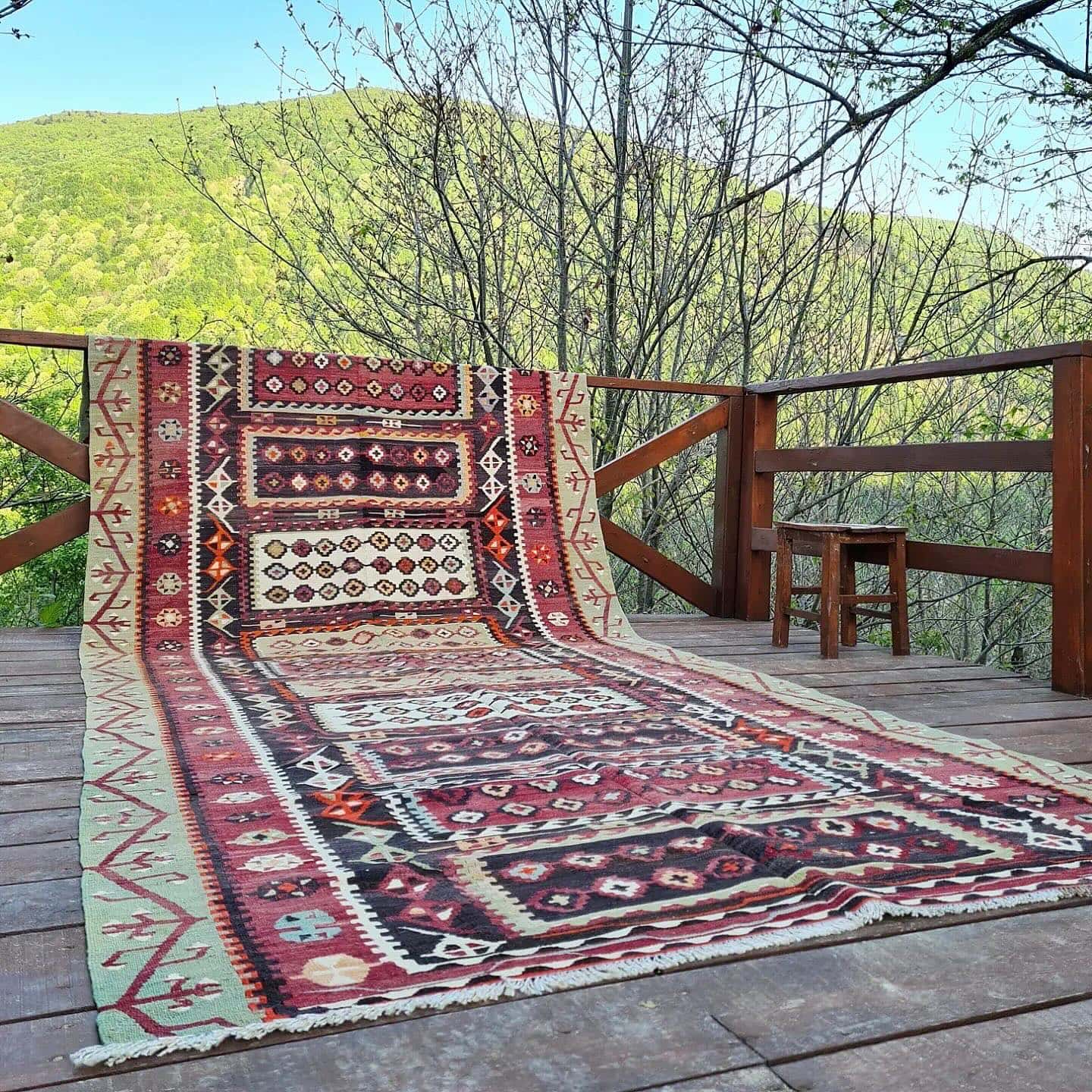 authentic farmhouse kelim rug showcased on a patio