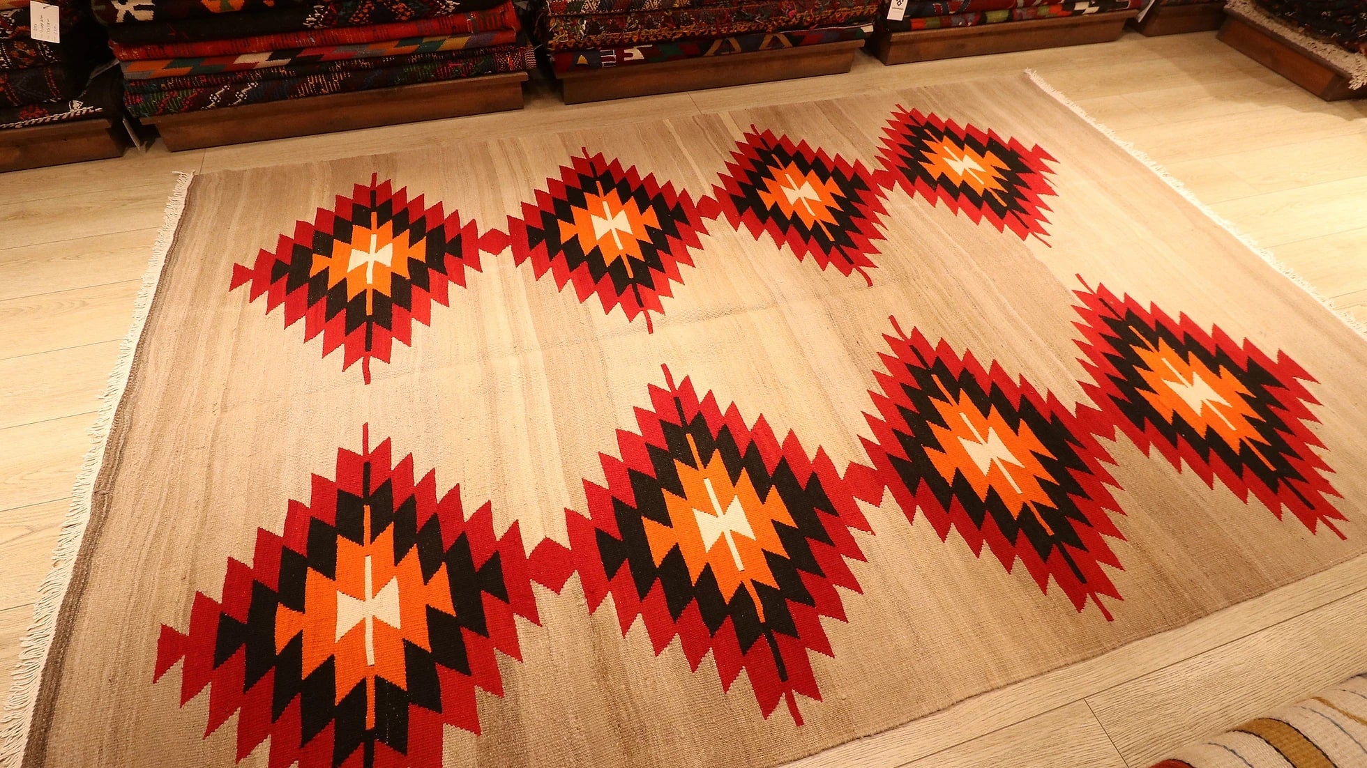 Handwoven Neutral Tribal Turkish Kilim Rug with red and orange lozenge patterns in beige